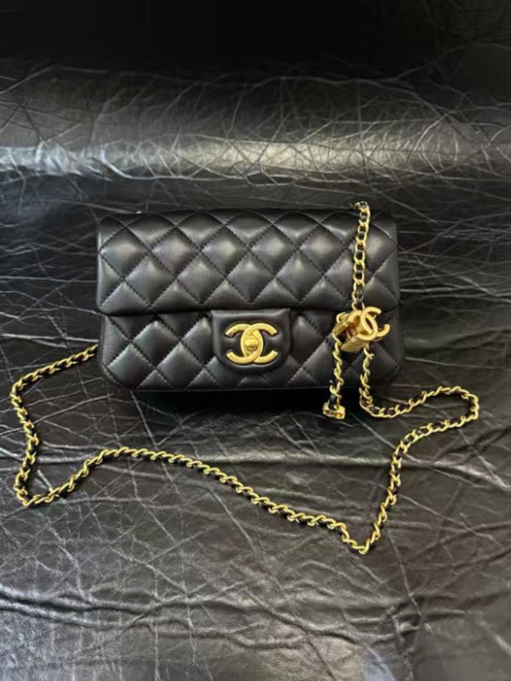 CHANEL Black Quilted Mini Flap Bag with Gold Chain & CC Lock